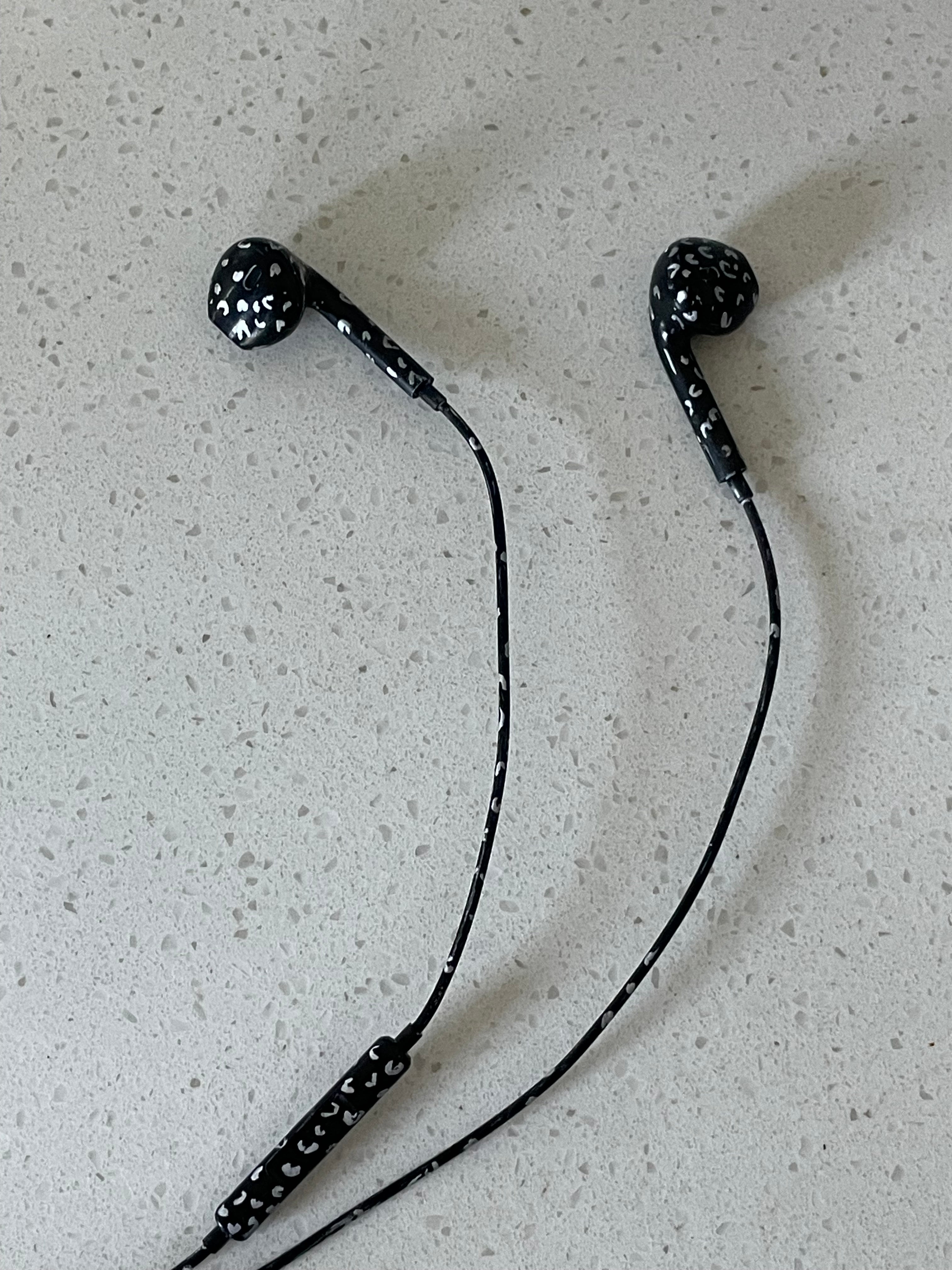 black and silver cheetah print earbuds